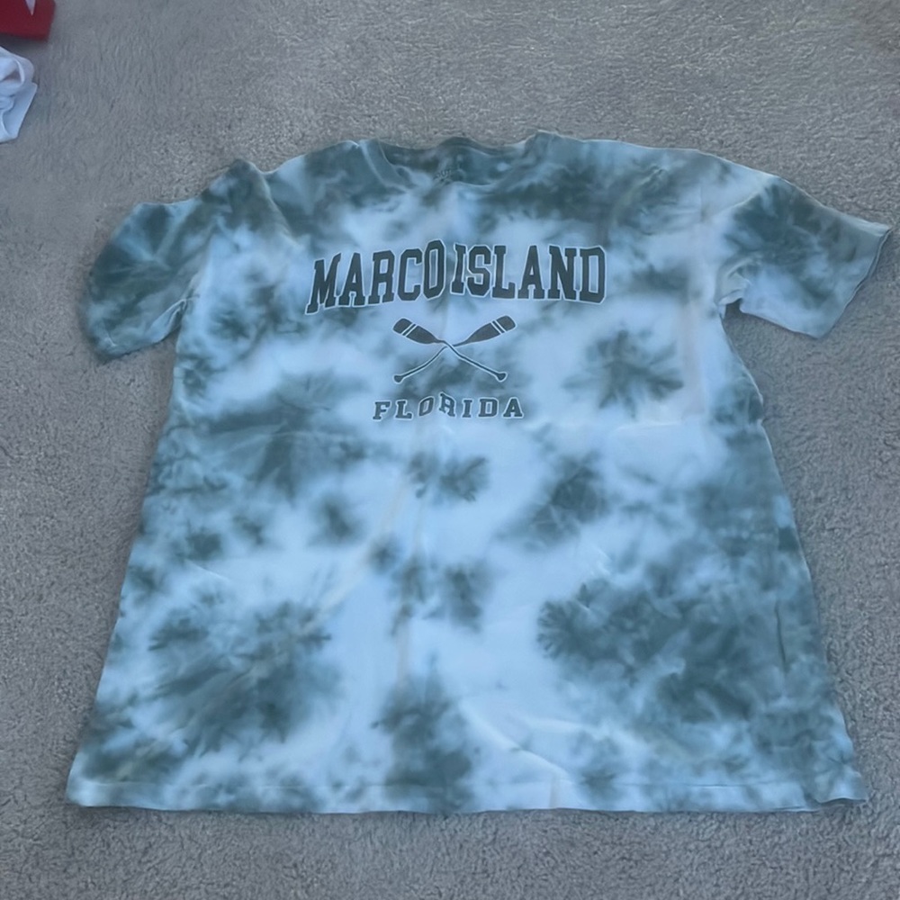 green/teal shirt
